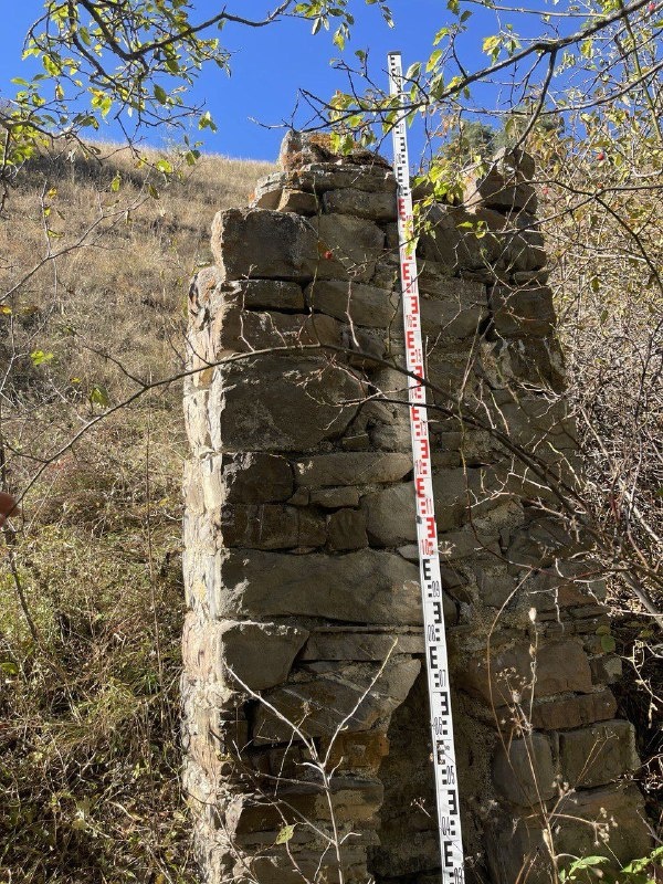 Employees of the Dzheyrah-Assinsky Museum-Reserve carried out planned work on accounting and fixation of previously unrecorded objects of cultural heritage.

This time the trip was made to the rarely visited tower complex in the eastern part of the Guloikhi Gorge - "Besht", where the ruins of four residential towers are preserved.

The described monument - a pillar-shaped sanctuary or, as it is popularly called, sieling - is located 300 meters west of the complex. Its height is 2.50 m, length is 1.10 m, width is 0.65 m. Below, on the facade of the object there is a lancet beggar with a height of 0.8 m.

In his studies, the Ingush historian and archaeologist M.B. Muzhukhoev believed that pillar-shaped sanctuaries complete the evolution of local religious monuments. And some scientists, on the contrary, believe that pillar-shaped structures are the primary form of religious buildings.

M.B. Musukhoev also claims that the construction of sielings was performed in memory of deceased ancestors. These monuments served as a symbol of veneration and respect for ancestors, and were believed to provide invisible protection to their descendants.

Ethnographic descriptions acquaint us with monolithic "pillars" - sanctuaries known as "Sielings", indicating their mythological connection with the cult of "the sun god" and lightning "Selya". A typical example of the sanctuary-monument is the sielings near the village of Erzi, Egikal, Targim, Niy, Vovnushki, Ozdeche, etc. in Ingushetia.

Researcher F.M. Kostoeva believes that in ancient times, the term "seeling" was used to refer to a high quadrangular stone column facing south, with a flat or gable top and a small niche at the base. The sielings were collected from raw stone before human growth and fixed to a lime or clay solution ("markhal"). Such stone structures were erected at crossroads, at towers or crypts.

As for this structure, we did not find its description in any written source. Employees carried out measurements of the object, photofixation. The monument will be included in the list of identified objects of cultural heritage of the republic, as well as put into scientific circulation, and it will be of interest to all who are interested in the history of Ingushetia.